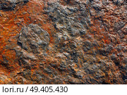Stone texture in the beach shore with red oxide. Стоковое фото, агентство Ingram Publishing / Фотобанк Лори