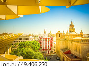 cityscape of Seville and roof of Metropolitan Parasol, Spain, toned. cityscape of Seville, Spain. Стоковое фото, агентство Ingram Publishing / Фотобанк Лори