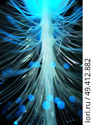 An amazing and vibrant macro of blue fiber optical pipes that illuminate making sparkles and glitters with black background. Стоковое фото, агентство Ingram Publishing / Фотобанк Лори