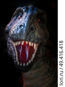 dinosaur tyrannosaurus rex growls in the forest. Стоковое фото, агентство Ingram Publishing / Фотобанк Лори