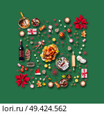 Various Christmas foods and red decoration for Christmas dinner. Composition pattern on green background, top view. Стоковое фото, агентство Ingram Publishing / Фотобанк Лори