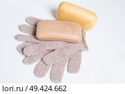 high-grade natural aroma soaps with washing mitten at wite background. Стоковое фото, агентство Ingram Publishing / Фотобанк Лори