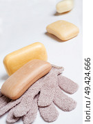 high-grade natural aroma soaps with washing mitten at wite background. Стоковое фото, агентство Ingram Publishing / Фотобанк Лори