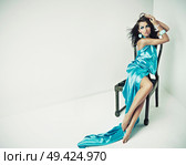 Sensual woman sitting on a chair. Стоковое фото, агентство Ingram Publishing / Фотобанк Лори