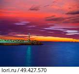 Alicante Cabo Las Huertas beacon light at sunset on Pier Spain. Стоковое фото, агентство Ingram Publishing / Фотобанк Лори