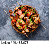 Chicken kebab on skewers with mushrooms.Barbeque meat dish. Grilled shish kebab on skewers. Стоковое фото, агентство Ingram Publishing / Фотобанк Лори