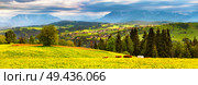 Poland spring Tatra mountains panorama. Green dandelion spring meadow on hills. Vacation, travel in Europe. Стоковое фото, агентство Ingram Publishing / Фотобанк Лори