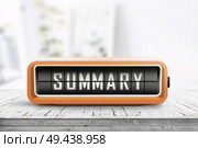 Summary sign device on a weathered wooden table in a bright room. Стоковое фото, агентство Ingram Publishing / Фотобанк Лори