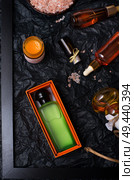 set of nature precious oils and  cosmetics on black background . Стоковое фото, агентство Ingram Publishing / Фотобанк Лори