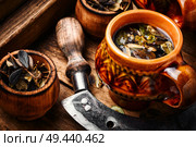 Cup of healthy herbal tea.Cowberry leaf tea. Cup of healthy tea. Стоковое фото, агентство Ingram Publishing / Фотобанк Лори