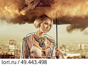 Conceptual portrait of a woman holding a smoky umbrella. Стоковое фото, агентство Ingram Publishing / Фотобанк Лори