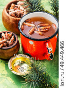 Tea with pine buds for treating colds.Herbal medicine.Delicious herbal tea. Tea with pine buds. Стоковое фото, агентство Ingram Publishing / Фотобанк Лори