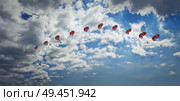Man paragliding in the sky captured in different phases. Extreme sport. Стоковое фото, агентство Ingram Publishing / Фотобанк Лори