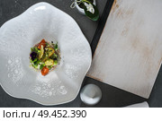 Beautiful and tasty gourmet food with menu . Стоковое фото, агентство Ingram Publishing / Фотобанк Лори