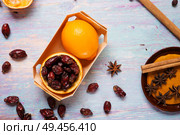 blue wooden background with cinnamon, anise, dog rose  and lemon. Стоковое фото, агентство Ingram Publishing / Фотобанк Лори