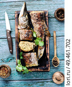 Baked grilled fish.Pike fish stuffed with mushrooms.Pike royally. Russian cuisine. Pike stuffed with vegetables. Стоковое фото, агентство Ingram Publishing / Фотобанк Лори