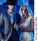 Amorous, young couple posing on a rainy bacground. Стоковое фото, агентство Ingram Publishing / Фотобанк Лори