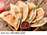 Cheburek, unleavened patty stuffed with minced meat.Traditional Tatar pastry. Cheburek,dough pie with meat filling. Стоковое фото, агентство Ingram Publishing / Фотобанк Лори