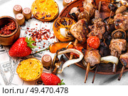 Summer picnic with shashlik and lotto board game. Picnic with barbecue and board game. Стоковое фото, агентство Ingram Publishing / Фотобанк Лори