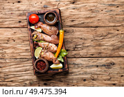 Grilled squid stuffed with vegetables.Seafood on wooden table.Baked squid. Grilled squid with vegetables. Стоковое фото, агентство Ingram Publishing / Фотобанк Лори