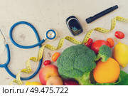 raw vegetables with blood glucose meter, lancet and stethoscope, diabetes healthy diet concept, toned. Diabetes healthy diet. Стоковое фото, агентство Ingram Publishing / Фотобанк Лори