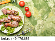 Grilled squid stuffed with vegetables.Seafood on plate. Grilled squid with vegetables. Стоковое фото, агентство Ingram Publishing / Фотобанк Лори