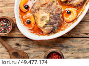Ossobuco, traditional dish of Italian cuisine. Stewed veal leg. Ossobuco, beef with apricot. Стоковое фото, агентство Ingram Publishing / Фотобанк Лори