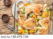 Chicken with vegetables.Chicken thighs baked with zucchini. Grilled chicken.Roasted chicken legs. Baked chicken with zucchini. Стоковое фото, агентство Ingram Publishing / Фотобанк Лори
