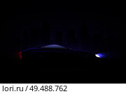 Lightened luxury sedan car against night city background with headlamps and rear tail lights lit vector illustration. Стоковая иллюстрация, агентство Ingram Publishing / Фотобанк Лори