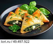 Spinach and feta stuffed spanakopita. Стоковое AI-изображение, AI-художник Татьяна  Бральнина / Фотобанк Лори