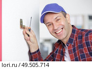 an electrician is working safely. Стоковое фото, агентство Ingram Publishing / Фотобанк Лори