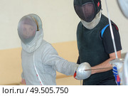 a couple during fencing training. Стоковое фото, агентство Ingram Publishing / Фотобанк Лори