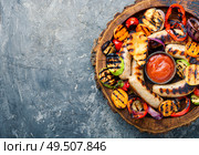 Grilled sausages fried with pear and vegetables. Autumn food.. Grilled sausages with vegetables. Стоковое фото, агентство Ingram Publishing / Фотобанк Лори