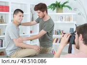 young men posing indoors for photo shoot. Стоковое фото, агентство Ingram Publishing / Фотобанк Лори