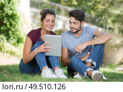 cute uni students studying together in nature. Стоковое фото, агентство Ingram Publishing / Фотобанк Лори