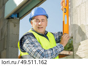 middle aged land surveyor working outdoors. Стоковое фото, агентство Ingram Publishing / Фотобанк Лори