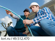 inspectors inspecting outdoor electrical tube. Стоковое фото, агентство Ingram Publishing / Фотобанк Лори