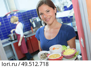 outgoing female holding food tray. Стоковое фото, агентство Ingram Publishing / Фотобанк Лори