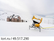 Spain, Andalusia, Granada. Snow cannon in operation at the Sierra Nevada ski resort. Travel and sports concepts.. Snow cannon in operation in Sierra Nevada. Стоковое фото, агентство Ingram Publishing / Фотобанк Лори