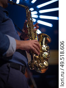 musician with saxophone performs at a concert. Стоковое фото, агентство Ingram Publishing / Фотобанк Лори