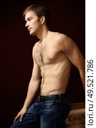 Man with the bared torso against a dark background. Стоковое фото, агентство Ingram Publishing / Фотобанк Лори