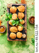 Champignon mushrooms in breadcrumbs.Breaded mushrooms or deep-fried mushrooms. Homemade breaded mushrooms. Стоковое фото, агентство Ingram Publishing / Фотобанк Лори