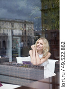 Beautiful girl in a restaurant in a glass. Стоковое фото, агентство Ingram Publishing / Фотобанк Лори