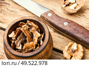 Healing properties of walnuts.Walnut membrane on wooden table.Walnut partitions. Walnut medicinal partitions. Стоковое фото, агентство Ingram Publishing / Фотобанк Лори