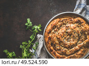 Turkish cuisine. Savory pie with Phyllo dough. Su boregi, burek or borek on dark rustic background. Top view. Стоковое фото, агентство Ingram Publishing / Фотобанк Лори