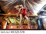 The attractive girl dances a striptease in club. Стоковое фото, агентство Ingram Publishing / Фотобанк Лори