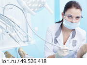 The doctor treating your child?s teeth in the dental clinic. Стоковое фото, агентство Ingram Publishing / Фотобанк Лори