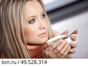 The young nice girl with a tea cup close up. Стоковое фото, агентство Ingram Publishing / Фотобанк Лори