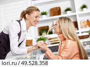 Two attractive girlfriends have met in cafe. Стоковое фото, агентство Ingram Publishing / Фотобанк Лори