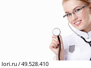 Attractive doctor with a stethoscope on a white background. Стоковое фото, агентство Ingram Publishing / Фотобанк Лори